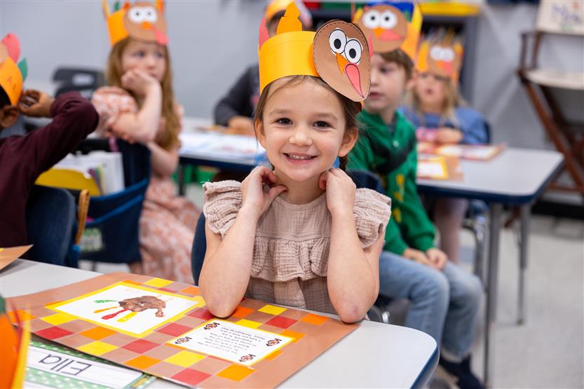 Creekside kindergartners and their families enjoy breakfast